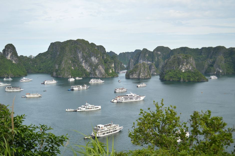 Explore the stunning limestone islands and cruise boats of Ha Long Bay, Vietnam. (photo by Valeria Drozdova on Pexels)