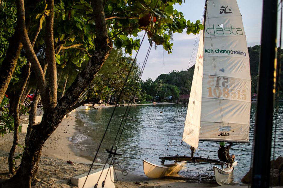 Bangkok to Koh Chang: Bus and Ferry Guide (2026) Small sailboat on a serene beach at Koh Chang, Thailand, perfect for a tropical getaway. (photo by Oleg Prachuk on Pexels)