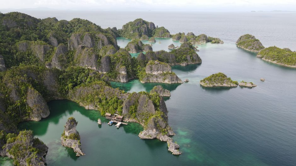 Stunning aerial view of the lush islands in Raja Ampat, Papua, Indonesia. (photo by Andi saiful Sidik on Pexels)