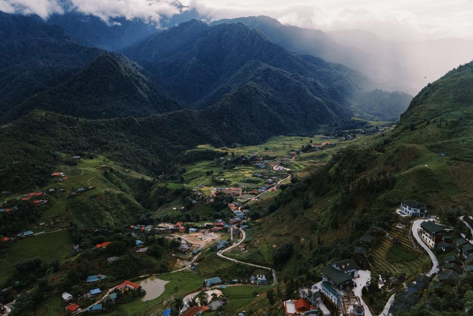 Hanoi to Sapa: Train, Bus and Sleeper Guide (2026) Stunning aerial view of Lào Cai's lush valley and mountains, captured during the day. (photo by Lucas Tran on Pexels)