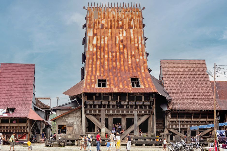 Explore a vibrant traditional Indonesian village featuring unique rusty-roof architecture and bustling local life. (photo by Man Fong Wong on Pexels)