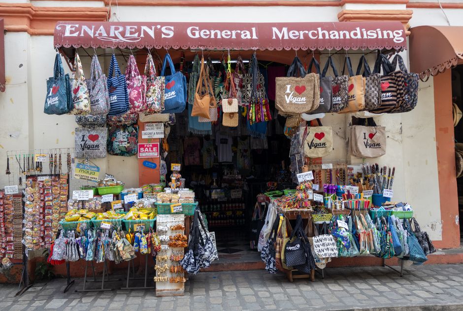 Explore a colorful souvenir shop in Vigan, Philippines, showcasing bags, crafts, and snacks. (photo by Melanie Casabar on Pexels)