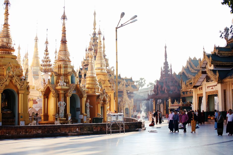 Capture of the iconic Shwedagon Pagoda with visitors, a symbol of Buddhism in Yangon, Myanmar. (photo by Tony Wu on Pexels)